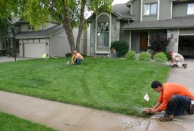 Installing three new heads during a sprinkler repair in Richardson, Texas