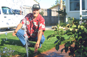 a tech prepares to remove a broken sprinkler head